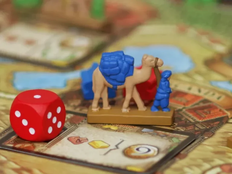 Stadtkarte mit einem roten Würfel und einer Ressourcenkarte
Fotoquelle: BGG