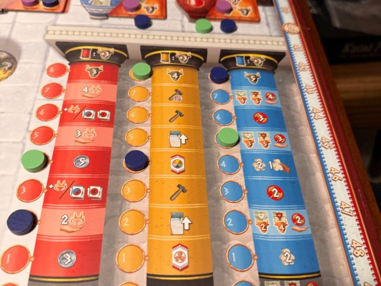 Stadtkarte mit einem roten Würfel und einer Ressourcenkarte
Fotoquelle: BGG